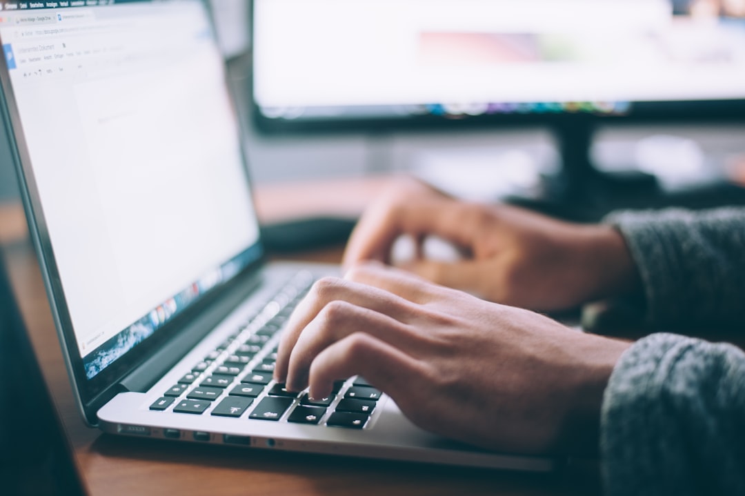business email workspace with a laptop and security concept — Photo by Glenn Carstens-Peters on Unsplash. Source: https://unsplash.com/photos/person-using-macbook-pro-npxXWgQ33ZQ
